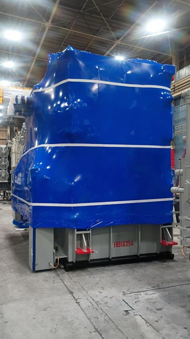 Power transformer sealed in blue shrink wrap with white reinforcement banding